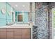 Chic bathroom with modern vanity, mosaic tile in shower, and bright, airy ambiance at 3130 Walnut Ne St, St Petersburg, FL 33704