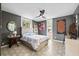 Comfortable bedroom featuring an overhead fan, tiled flooring, and sunlit windows at 3130 Walnut Ne St, St Petersburg, FL 33704