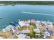 Stunning aerial view of a waterfront property featuring a boat dock and lush green landscaping at 326 176Th Avenue Cir, Redington Shores, FL 33708