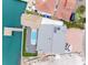 Overhead view of a waterfront home featuring a private dock, swimming pool, and outdoor living space at 326 176Th Avenue Cir, Redington Shores, FL 33708