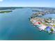 Aerial shot of a waterfront home with a private dock and a bay view at 326 176Th Avenue Cir, Redington Shores, FL 33708