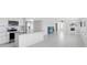 Open concept kitchen and living area with modern appliances and ample counter space at 326 176Th Avenue Cir, Redington Shores, FL 33708