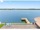 Expansive water view from the deck featuring a private dock and tiki bar at 326 176Th Avenue Cir, Redington Shores, FL 33708