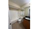 Bathroom includes a tub/shower combo and vanity with black countertop at 3260 Haviland Ct # 202, Palm Harbor, FL 34684