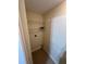 Functional laundry room with tile flooring and wire shelving for organized storage at 3260 Haviland Ct # 202, Palm Harbor, FL 34684