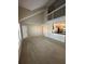 Spacious living area with large windows, a high ceiling, and an open floor plan at 3260 Haviland Ct # 202, Palm Harbor, FL 34684