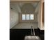 Open-concept living room with vaulted ceilings and a view from the kitchen at 3260 Haviland Ct # 202, Palm Harbor, FL 34684