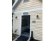 Mailboxes inside of a covered vestibule with decorative wall mounted lights at 3260 Haviland Ct # 202, Palm Harbor, FL 34684