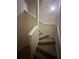 Carpeted staircase with white railings at 3260 Haviland Ct # 202, Palm Harbor, FL 34684