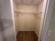 Carpeted walk-in closet features white wire shelving at 3260 Haviland Ct # 202, Palm Harbor, FL 34684