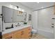 Bathroom featuring modern fixtures, vanity, and a shower over the tub at 3417 W Alline Ave, Tampa, FL 33611