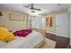 Bedroom featuring hardwood floors, neutral colors, a ceiling fan, and natural light at 3417 W Alline Ave, Tampa, FL 33611