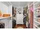 Spacious walk-in closet featuring custom shelving, drawers, and rods for ample storage at 3417 W Alline Ave, Tampa, FL 33611