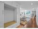 Inviting entryway with custom storage, bench seating, and views into the open-concept living area at 3417 W Alline Ave, Tampa, FL 33611