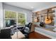 Cozy home office with hardwood floors, natural light, and a guitar-themed accent wall at 3417 W Alline Ave, Tampa, FL 33611