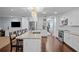 Modern kitchen featuring an island with bar seating, stainless appliances, and ample cabinet space at 3417 W Alline Ave, Tampa, FL 33611