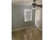 Bedroom with a ceiling fan, neutral walls, window with blinds and tile floors at 3502 E 33Rd Ave, Tampa, FL 33610