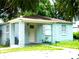 Charming single-story home with a covered porch, light blue exterior, and white trim at 3502 E 33Rd Ave, Tampa, FL 33610