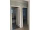 Hallway view of the bathroom and bedroom with tiled floors at 3502 E 33Rd Ave, Tampa, FL 33610