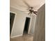Hallway view of the bedrooms with tiled floors and doors at 3502 E 33Rd Ave, Tampa, FL 33610