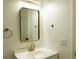 Modern bathroom featuring stylish vanity and sleek gold fixtures at 3530 Umber Rd, Holiday, FL 34691
