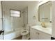 Updated bathroom with tub, marble tile, and modern fixtures at 3530 Umber Rd, Holiday, FL 34691