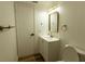 Modern bathroom features updated vanity, brushed gold accents, and stylish lighting at 3530 Umber Rd, Holiday, FL 34691