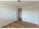 Bedroom with wood flooring, neutral walls, and natural light at 3530 Umber Rd, Holiday, FL 34691