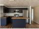 Modern kitchen with dark cabinets, stainless steel appliances, and wood countertops at 3530 Umber Rd, Holiday, FL 34691