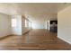 Spacious open-concept living area featuring wood floors and ample natural light at 3530 Umber Rd, Holiday, FL 34691