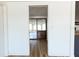 Covered patio with a hot tub beyond a doorway at 3530 Umber Rd, Holiday, FL 34691