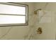 New shower featuring marble style tile, rainfall shower head and modern fixtures at 3530 Umber Rd, Holiday, FL 34691