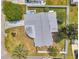 Bird's eye view of a property with a fenced yard, landscaping, and easy access to neighborhood streets at 3716 Carioca Rd, Holiday, FL 34691