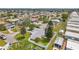 Aerial view of home in a residential community, featuring maintained landscaping and trees at 3716 Carioca Rd, Holiday, FL 34691