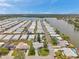 A waterfront community with rows of well-maintained homes, offering beautiful lake views and a serene environment at 3716 Carioca Rd, Holiday, FL 34691