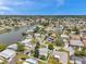 Residential neighborhood featuring attractive homes, green spaces, and a charming waterfront setting at 3716 Carioca Rd, Holiday, FL 34691