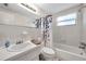 Full bathroom showcasing a shower-tub combo, a vanity, and a large mirror at 3716 Carioca Rd, Holiday, FL 34691