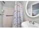 Bathroom features a walk-in shower with a shower curtain and grab bar at 3716 Carioca Rd, Holiday, FL 34691