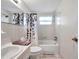 Bright bathroom with tub and shower featuring stylish curtain and fixtures at 3716 Carioca Rd, Holiday, FL 34691
