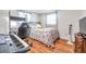 Comfortable bedroom with keyboard, desk, and laminate wood flooring at 3716 Carioca Rd, Holiday, FL 34691