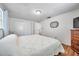 Bedroom featuring hardwood floors, a large closet and bright light at 3716 Carioca Rd, Holiday, FL 34691