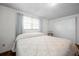 Bedroom featuring hardwood floors, a bed and bright light at 3716 Carioca Rd, Holiday, FL 34691