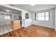Bright dining room with hardwood floors, open to the kitchen area at 3716 Carioca Rd, Holiday, FL 34691