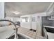 Open kitchen layout with stainless steel appliances and natural light at 3716 Carioca Rd, Holiday, FL 34691