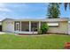 Enjoy outdoor living in this inviting lanai with neutral decor and ample seating at 3716 Carioca Rd, Holiday, FL 34691
