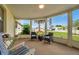 Comfortable seating arrangement on the lanai provides a relaxing outdoor living space at 3716 Carioca Rd, Holiday, FL 34691