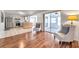 Open-concept layout showcasing the living room, porch, and kitchen, all seamlessly connected with modern flooring at 3716 Carioca Rd, Holiday, FL 34691