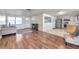 Spacious living room with wood floors, open to kitchen, creating an inviting atmosphere at 3716 Carioca Rd, Holiday, FL 34691
