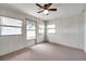 Bright sunroom featuring carpeted floors, ceiling fan, and multiple windows providing lots of natural light at 3716 Carioca Rd, Holiday, FL 34691