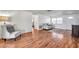 Bright living room featuring wood floors, chair, and gray loveseat, with good natural light at 3716 Carioca Rd, Holiday, FL 34691